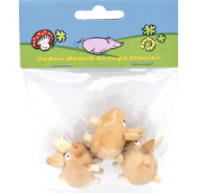 Drei kleine Holzschweinchen als Dekofiguren in einer Kunststoffverpackung mit der Aufschrift Jedes Stück bringt Glück