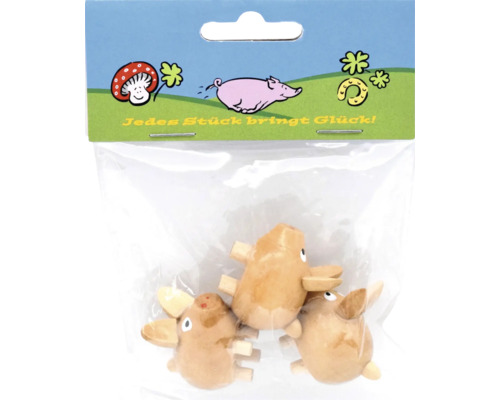 Drei kleine Holzschweinchen als Dekofiguren in einer Kunststoffverpackung mit der Aufschrift Jedes Stück bringt Glück