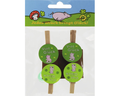 Set aus vier hölzernen Dekoklammern mit Schweinchenmotiv und der Aufschrift Viel Glück auf einer Verkaufsverpackung.