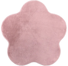 Blumenförmiger Teppich aus weichem Plüsch in Rosa.