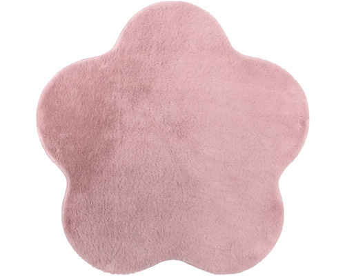 Blumenförmiger Teppich aus weichem Plüsch in Rosa.
