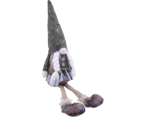 Sitzende Wichtelfigur mit hohem spitzen Hut, geflochtenen Zöpfen und langen Beinen.