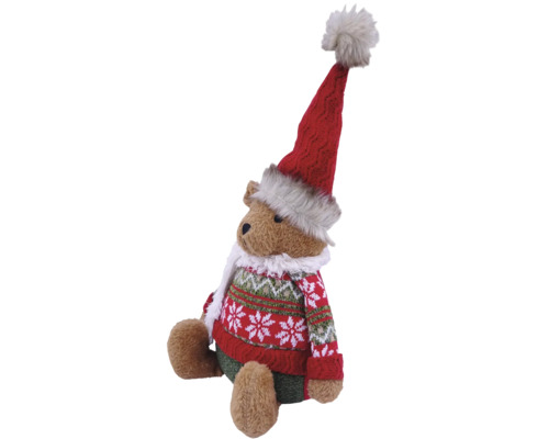 Weihnachts-Teddybär mit roter langer Mütze, weißem Schal und rot-grünem Strickpullover mit Schneeflockenmuster.