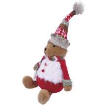 Sitzender Weihnachts-Teddybär mit rot-weißer Wintermütze, Schal und flauschigem rotem Outfit.
