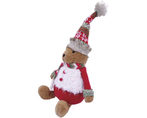 Sitzender Weihnachts-Teddybär mit rot-weißer Wintermütze, Schal und flauschigem rotem Outfit.