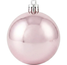 Glänzende rosa Christbaumkugel mit silberner Aufhängung.