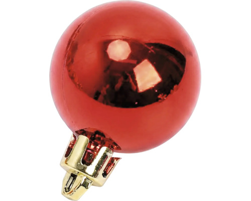 Glänzende rote Christbaumkugel mit goldener Kappe.