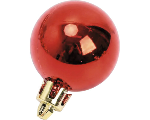 Glänzende rote Weihnachtskugel mit goldfarbenem Hütchen.