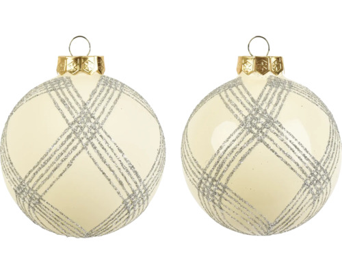 Zwei cremefarbene Weihnachtskugeln aus Glas mit silbernem Glitzermuster und goldener Aufhängung.