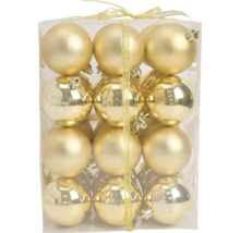Set aus goldenen Weihnachtskugeln mit matter und glänzender Oberfläche in einer Klarsichtbox mit Schleifenband.