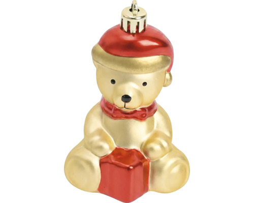 Christbaumschmuck in Form eines sitzenden Teddybären mit Weihnachtsmütze und Geschenk.