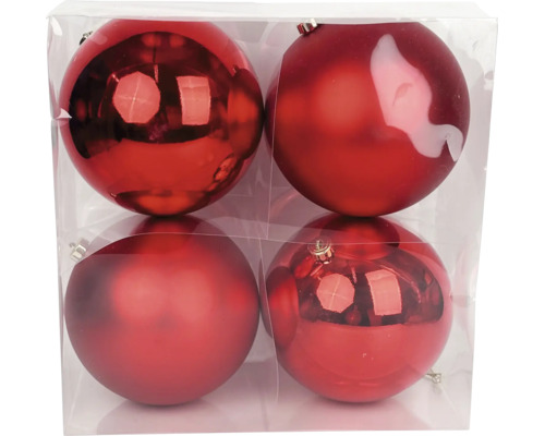 Vier rote Weihnachtskugeln in einer transparenten Verpackung, zwei glänzend und zwei matt.
