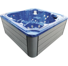 Quadratischer Außenwhirlpool mit blauer Wanne, grauer Außenverkleidung und integrierten Massagedüsen.