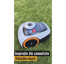 Mähroboter Navimow i105 auf einer Rasenfläche mit orangefarbenen Rädern und Bedienfeld.