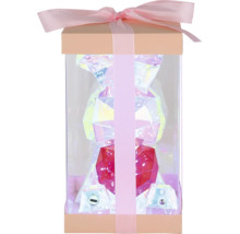 Geschenkbox mit einer glänzenden Kunstharzfigur in Bärenform und Schleife