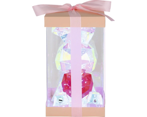 Geschenkbox mit einer glänzenden Kunstharzfigur in Bärenform und Schleife