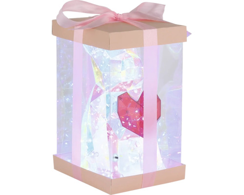 Beleuchtete Geschenkschachtel mit Dekoration und Schleife