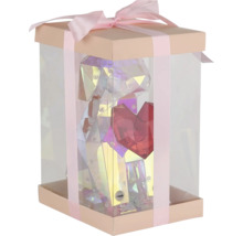 Geschenkbox mit einer transparenten Figur, die einen Hund mit Herz darstellt, verziert mit einer Schleife.