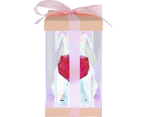 Geschenkbox mit Schleife, in der eine figurartige Skulptur mit einem roten Herzen steht