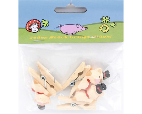 Set mit Deko Holzklammern in Schweinchenform in Kunststoffverpackung mit Glückssymbolen auf dem Aufhänger