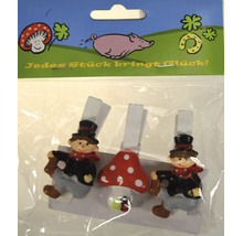 Drei dekorative Holzklammern mit Glückssymbolen wie Schornsteinfeger und Fliegenpilz in einer Kunststoffverpackung.