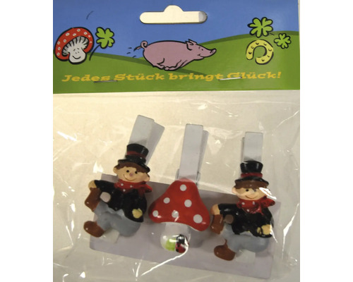 Drei dekorative Holzklammern mit Glückssymbolen wie Schornsteinfeger und Fliegenpilz in einer Kunststoffverpackung.