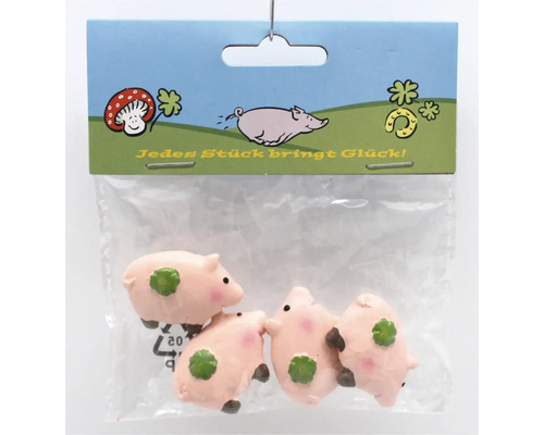 Set mit vier kleinen Glücksschweinen aus Kunststoff in einer transparenten Verpackung als Dekoration oder Geschenk.