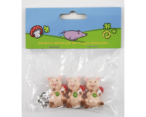 Drei kleine Glücksschweinchen Figuren aus Kunststoff in einer Verpackung mit der Aufschrift Jedes Stück bringt Glück