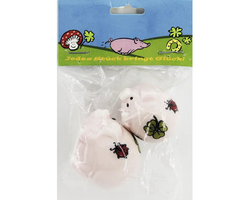Set aus zwei kleinen Dekoschweinen mit Marienkäfer und Kleeblatt Motiv in der Verpackung