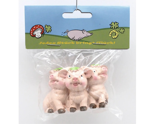 Drei kleine Glücksschweinchen Figuren als Dekoration in transparenter Verpackung
