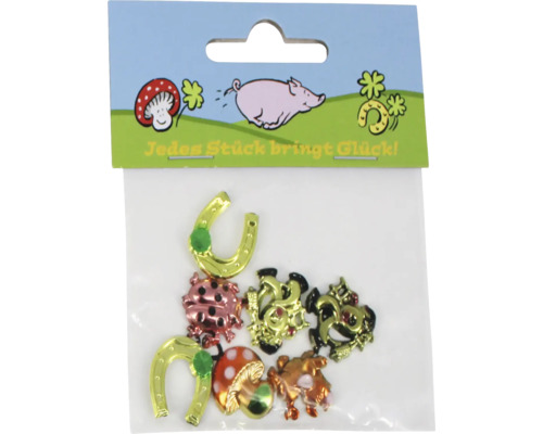 Set mit metallischen Glücksbringer Stickern wie Hufeisen, Glücksschweinen, Marienkäfern und Pilzen auf einer Karte