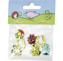 Set mit Glücksbringern bestehend aus Pilz, Marienkäfer, Hufeisen und Kleeblatt in einer Verkaufspackung zur Dekoration.