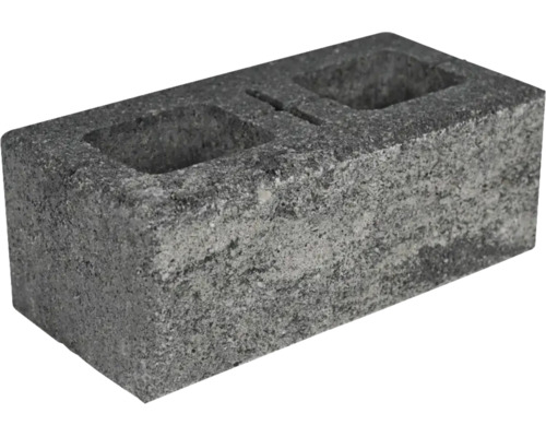Ein einzelner Hohlblockstein aus Beton mit strukturierter Oberfläche und zwei integrierten Öffnungen.