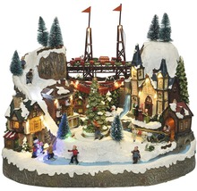 Animierte Winterdorf-Szene mit Zug, Häusern, Figuren und Beleuchtung