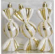 Drei weiße und goldfarbene Christbaumkugeln in Bonbonform