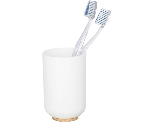 Zwei Zahnbürsten in einem weißen Zahnputzbecher