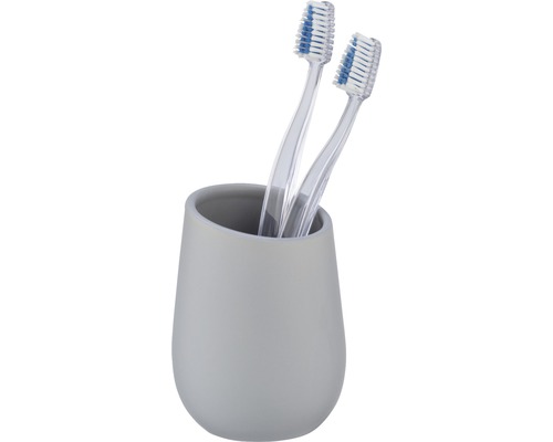 Zahnbürsten in grauem Zahnputzbecher