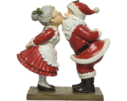 Dekorative Weihnachtsmann- und Weihnachtsfrau-Figur beim Küssen auf einem Sockel