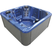Quadratischer Whirlpool mit grauer Verkleidung und blauer Innenwanne