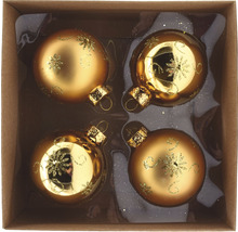 Vier goldfarbene Weihnachtskugeln mit Dekor in einer Schachtel