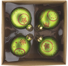 Vier grüne Weihnachtskugeln mit Sternmuster in einer Pappschachtel