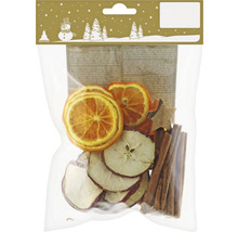 Verpackung mit Potpourri aus Apfelscheiben, Orangenscheiben und Zimtstangen