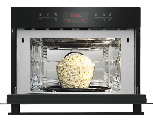 Mikrowelle mit einer Schüssel Popcorn