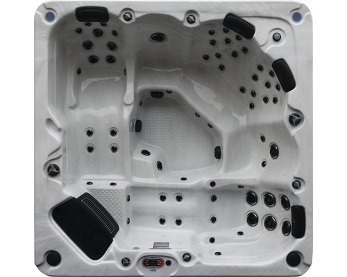 Aufnahme von oben eines Whirlpools mit mehreren Sitzen und eingebauten Düsen