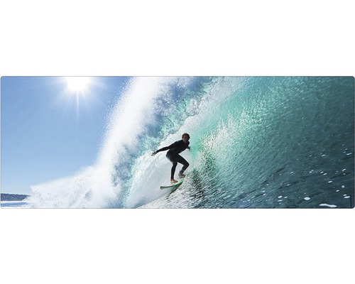 Badrückwand mySpotti Aqua Surfing USA 1200x450x2 mm 151235 blau Ein Surfer reitet auf einer Welle unter einem hellen Himmel.