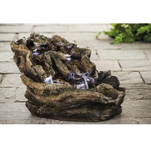 Dekorativer Zimmerbrunnen imitiert Baumstamm und Felsen mit Wasserkaskaden und LED Beleuchtung