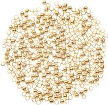 Viele goldfarbene Nietstifte mit Öse