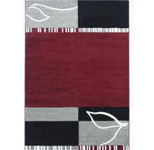 Teppich mit geometrischem Muster und Blätterdesign