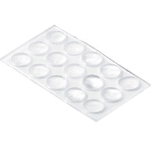 Transparente selbstklebende Möbelpuffer auf einer Folie