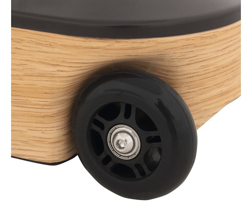 Detailansicht Rollkoffer mit schwarzem Rad und Holzgehäuse
